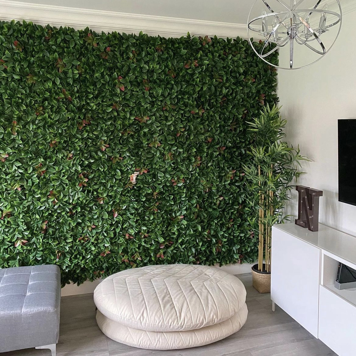 artificial autumn green and red hedge tiles used in sitting room feature wall