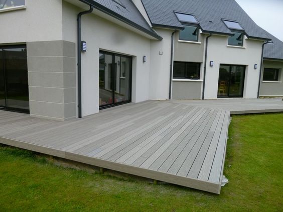 light grey decking around a house 