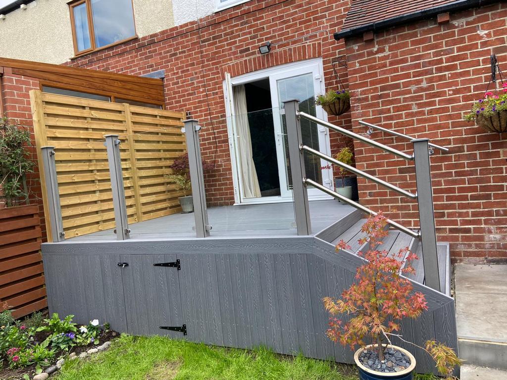 silver ash enhance composite decking boards for a raised decked area