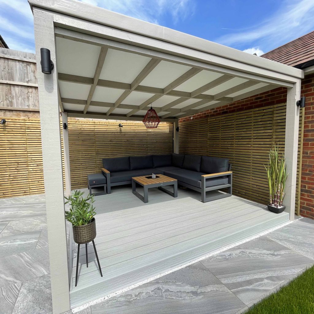 This decked garden features the deep embossed ash white composite decking boards 