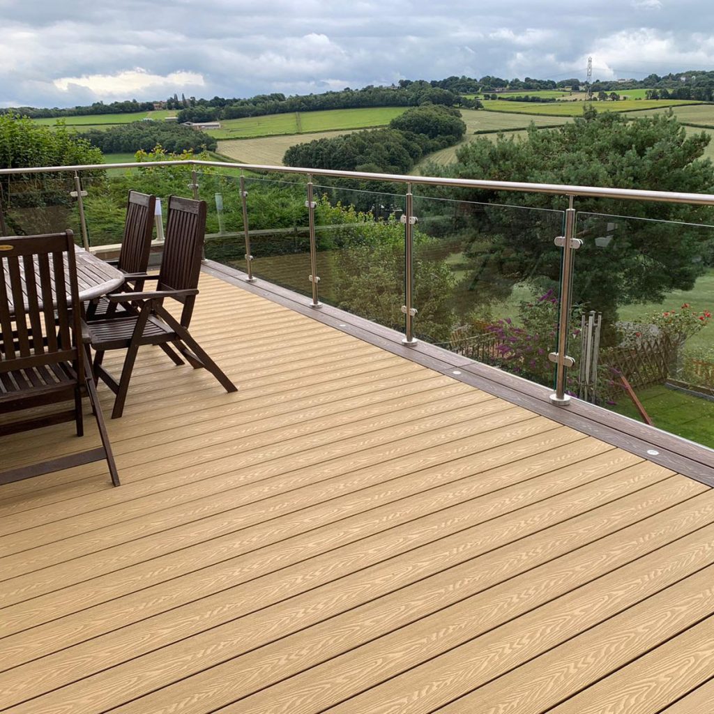 Aged oak composite decking boards perfect for a traditional uk garden style.