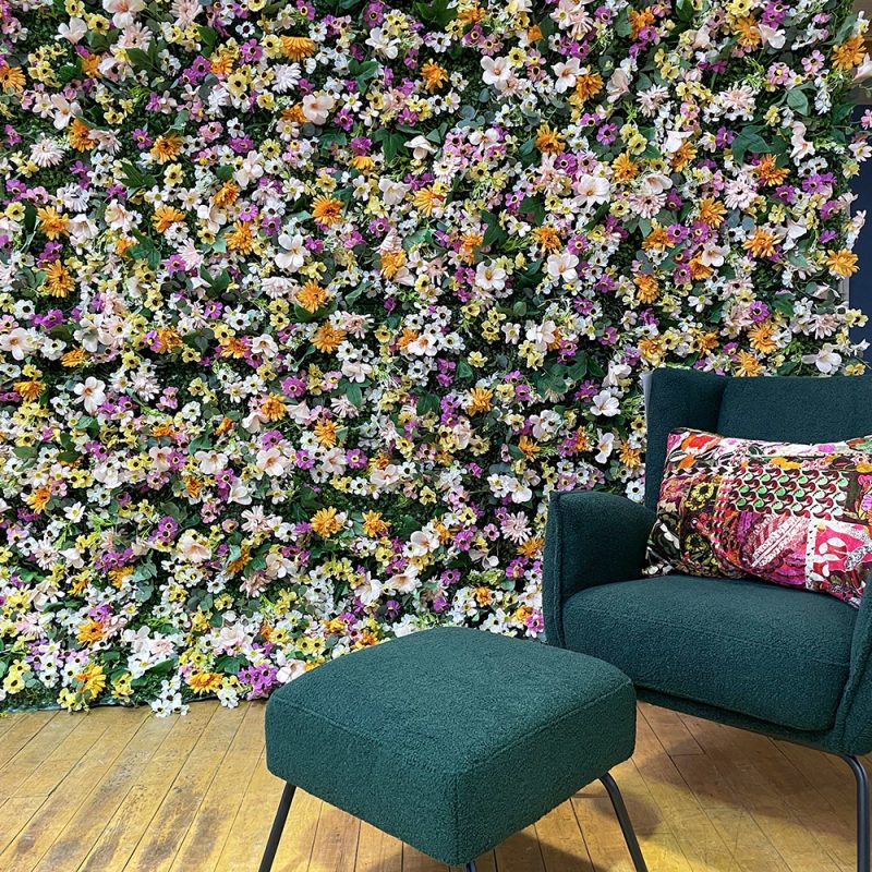 feature walls using artificial flowers for corporate event styling