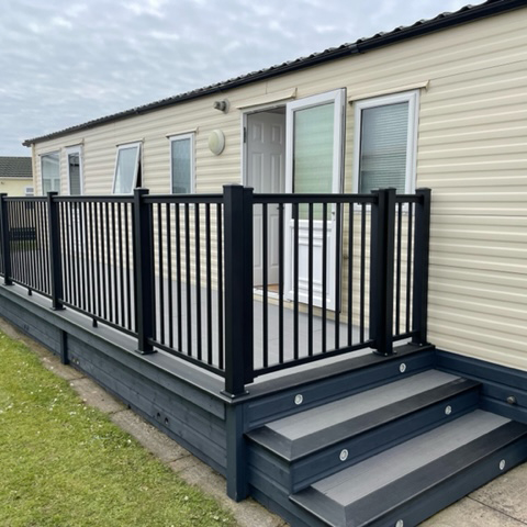 raised decking area with the aluminium balustrade system edging it for a sleek handrail.