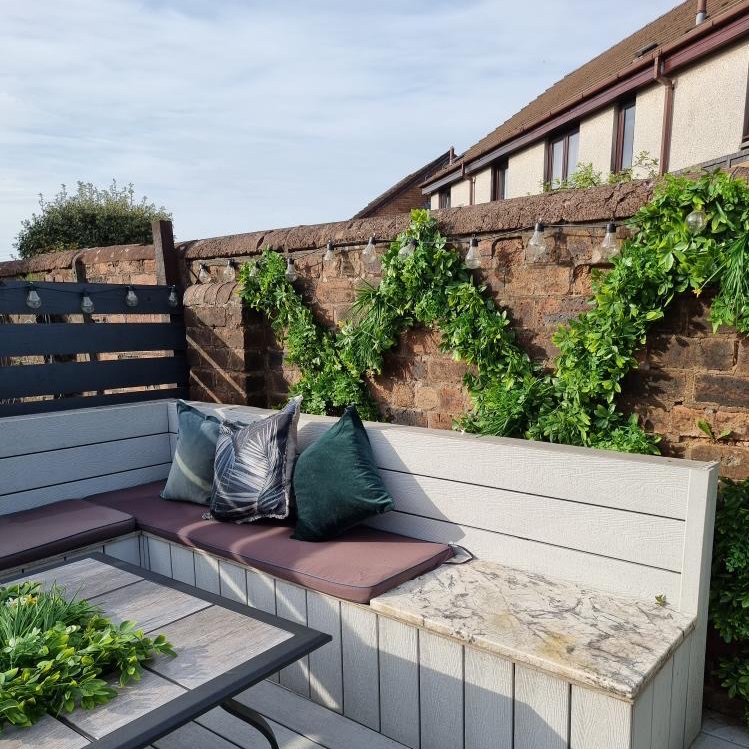 cutting the hedge tiles up to small pieces to create a trellis design