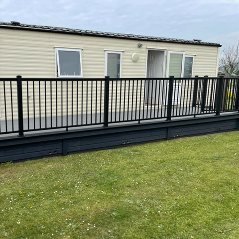 aluminium handrail system installed onto a wrap around decking by a static home