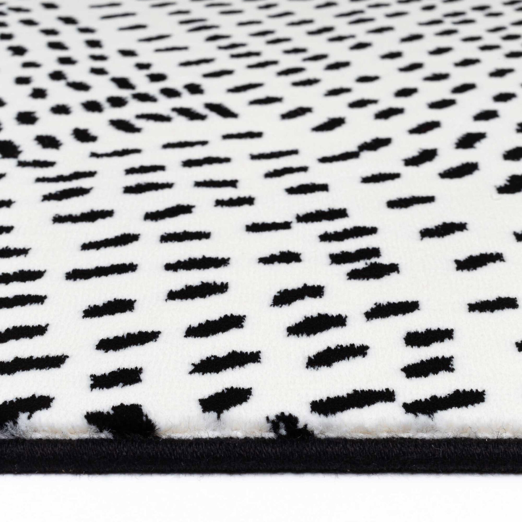 Tiago indoor rug spotted design white background with black spots