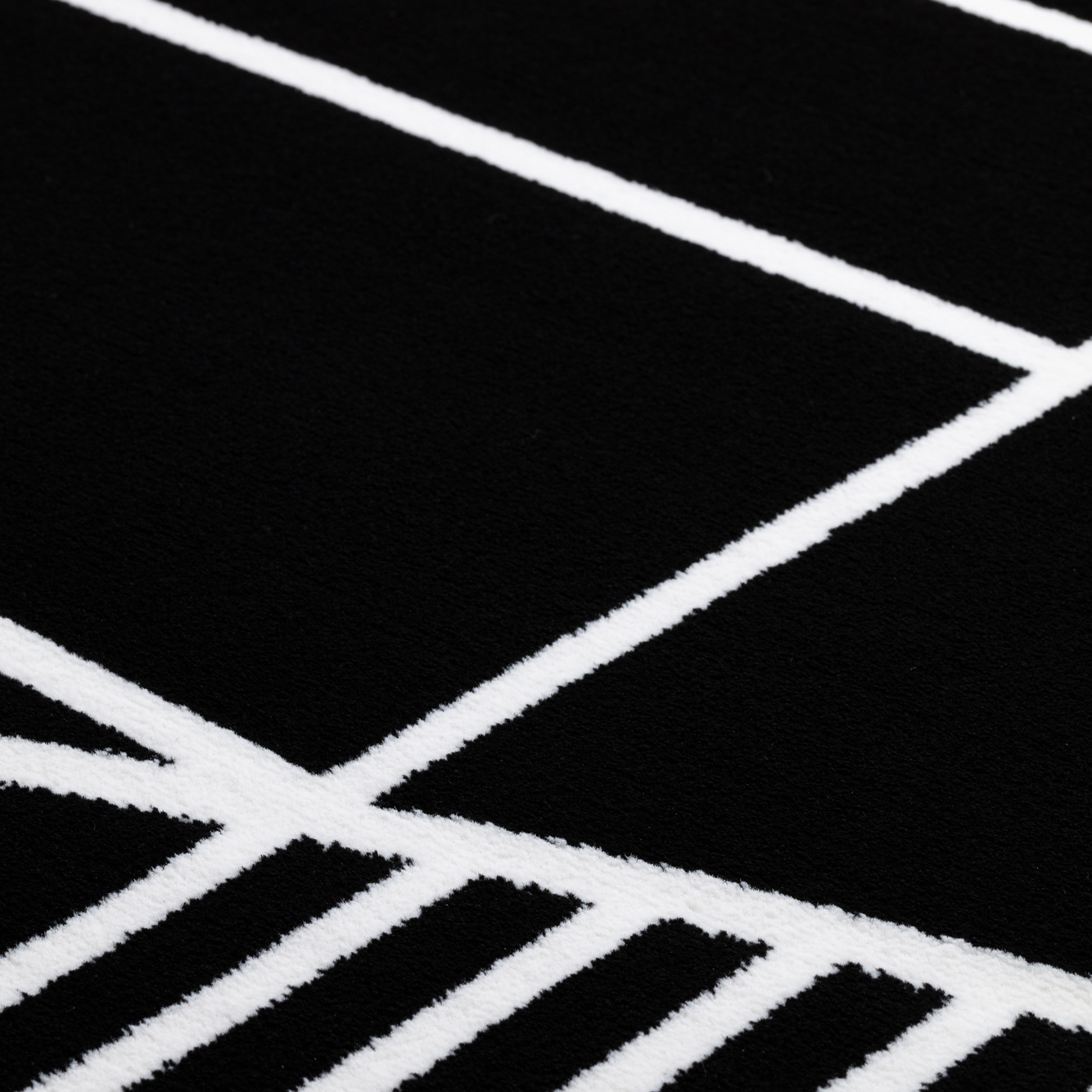 close up of the pattern in the Tiago structured rug in black