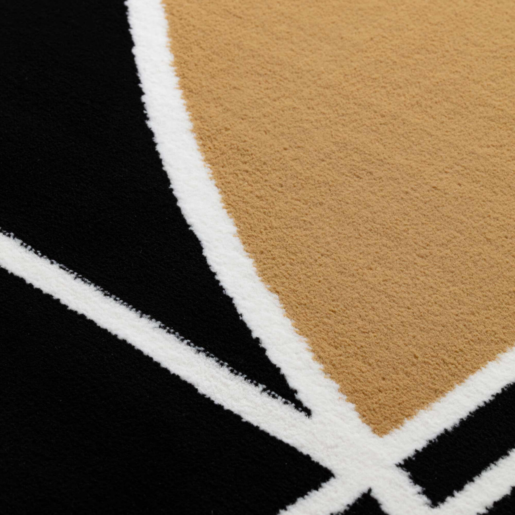 close up of Tiago structured rug in black and golden