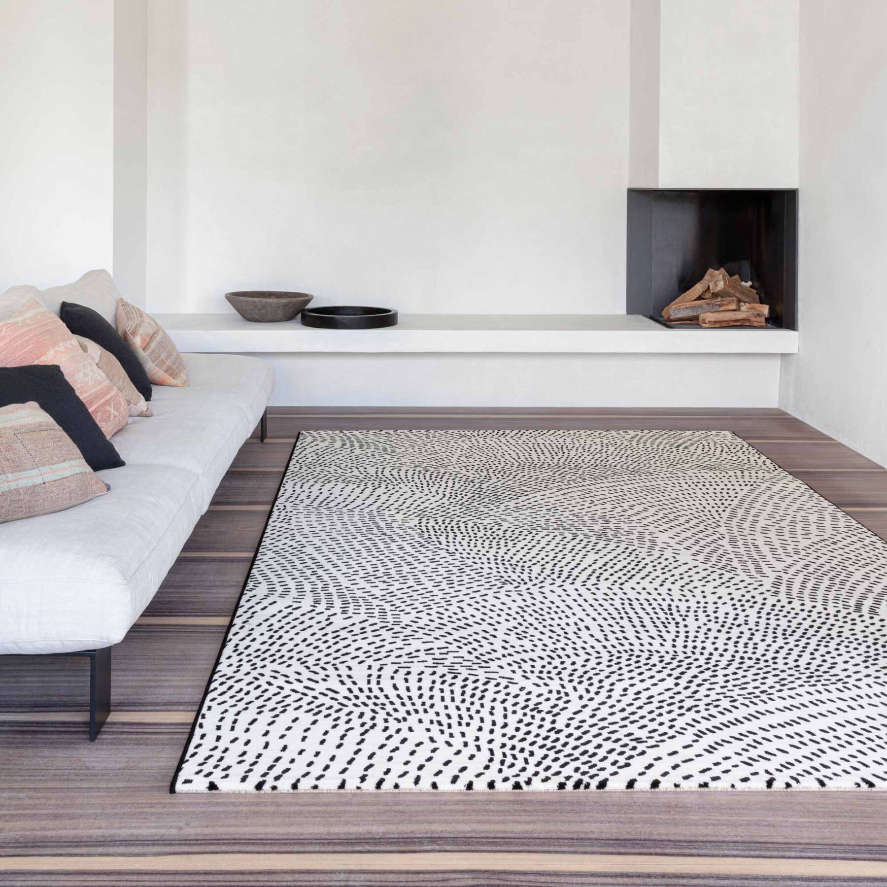 lifestyle view of Tiago indoor rug spotted design white background with black spots