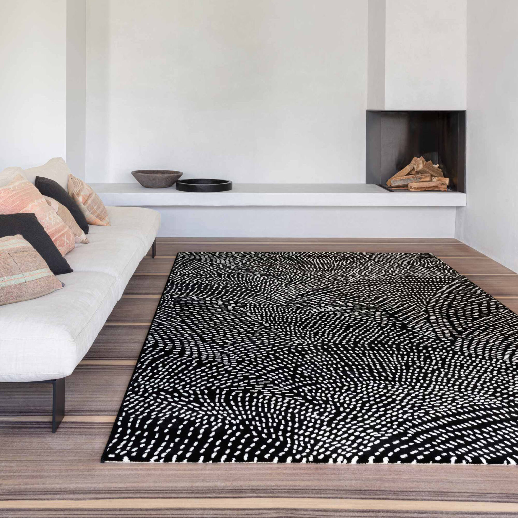 lifestyle look of Tiago indoor rug spotted design black background with white spots