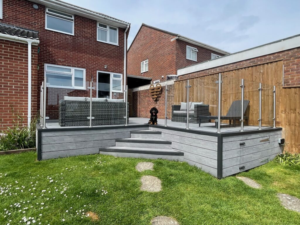 stainless steel and semi frameless glass railings installed in domestic garden